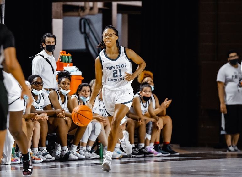 Taylor Rae Styles dribbles down the basketball court.