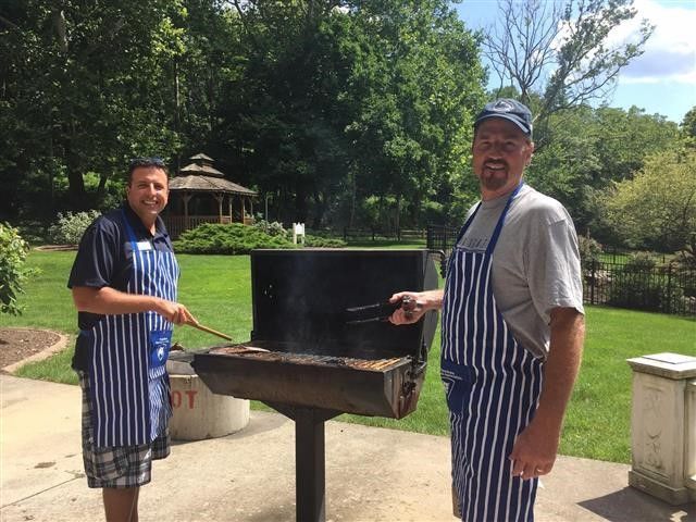 two men at a grille