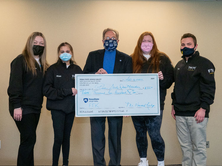 PSU-LV THON Dancers present check to donor Howard Kulp 