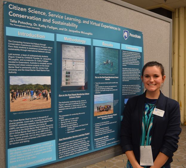 female student in front of poster